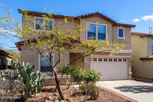12996 N Desert Olive Dr, Oro Valley, AZ 85755 - view of front of home with a garage