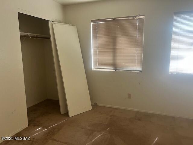 unfurnished bedroom featuring a closet