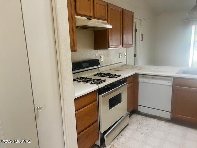 kitchen with sink and white appliances