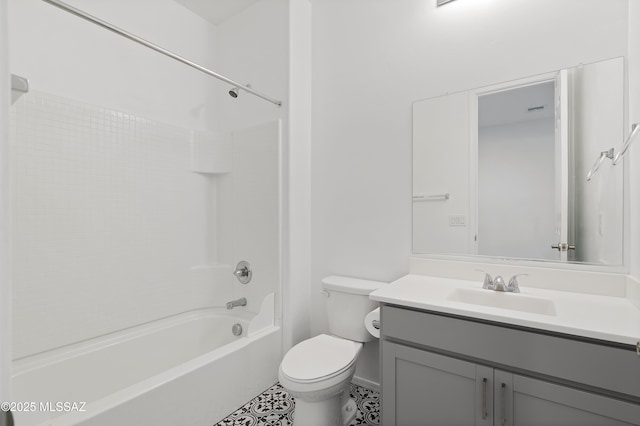 bathroom with shower / washtub combination, toilet, and vanity