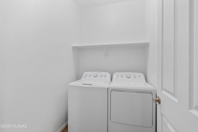 laundry room with washer and dryer and laundry area