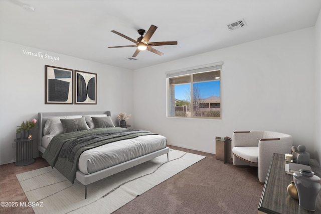 bedroom featuring visible vents, ceiling fan, and carpet floors