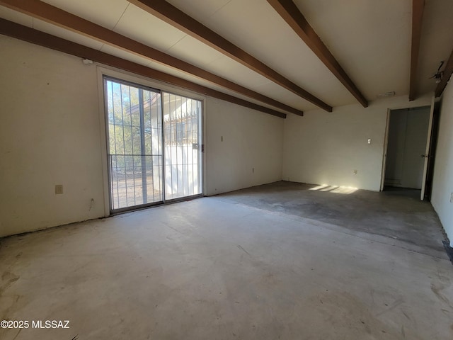 empty room featuring beam ceiling