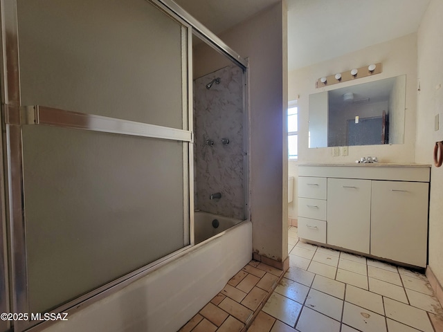 bathroom with vanity and bath / shower combo with glass door