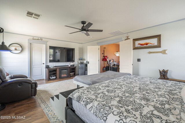bedroom featuring wood-type flooring and ceiling fan