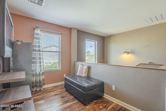 sitting room featuring dark hardwood / wood-style flooring