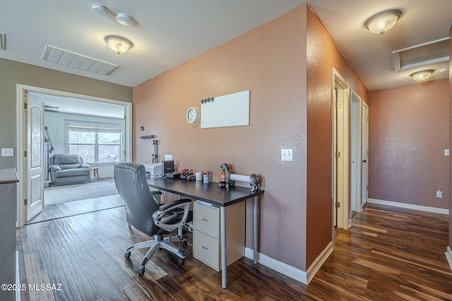 home office with dark hardwood / wood-style floors