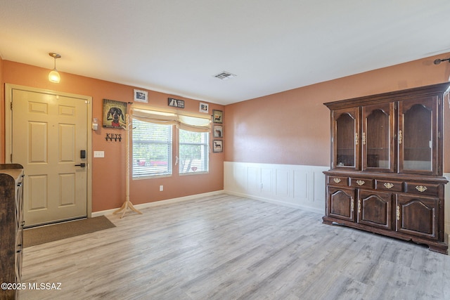 entryway with light hardwood / wood-style floors