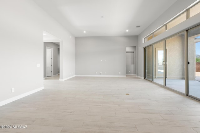 spare room featuring light hardwood / wood-style flooring