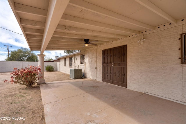 view of patio / terrace with central air condition unit, a ceiling fan, and a fenced backyard