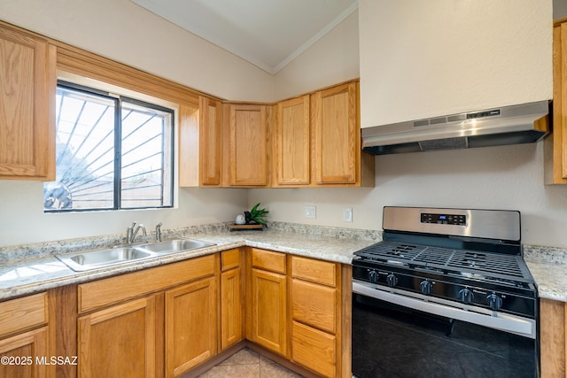 kitchen featuring light countertops, stainless steel gas stove, vaulted ceiling, a sink, and under cabinet range hood