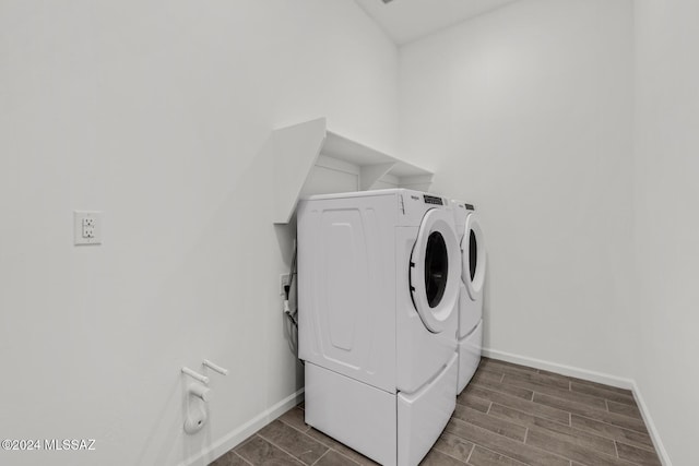 laundry area with washing machine and clothes dryer