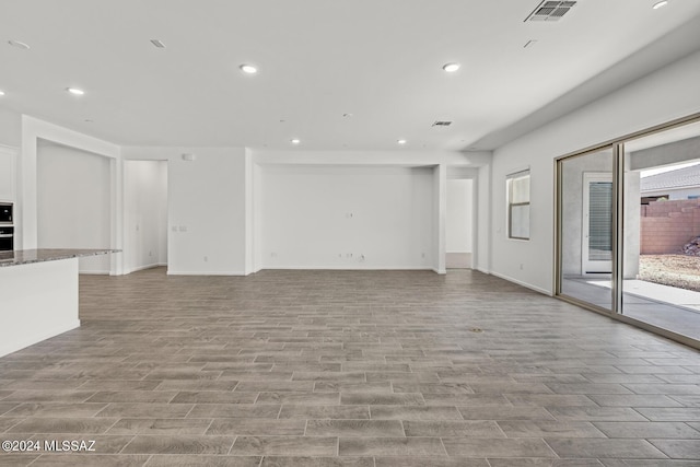 unfurnished living room with light hardwood / wood-style flooring