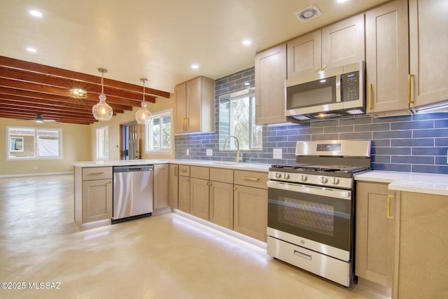 kitchen with pendant lighting, backsplash, kitchen peninsula, stainless steel appliances, and light brown cabinets