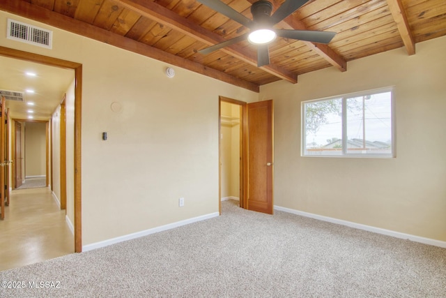 unfurnished room with wood ceiling, ceiling fan, beam ceiling, and light carpet