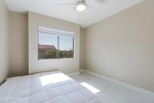 bedroom featuring marble finish floor, baseboards, and ceiling fan