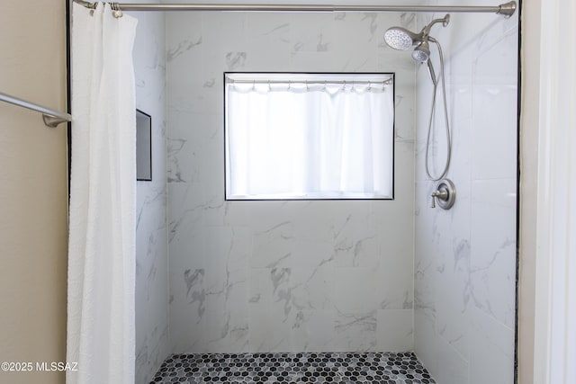 bathroom featuring a shower stall