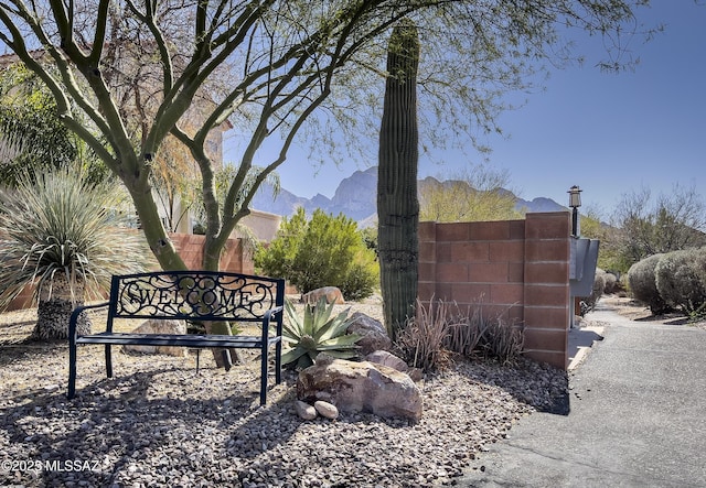 community sign featuring a mountain view