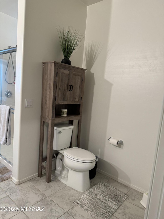 bathroom with walk in shower and toilet