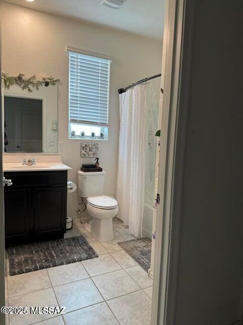 full bathroom with tile patterned floors, vanity, toilet, and shower / bath combo