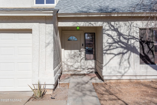 entrance to property featuring a garage