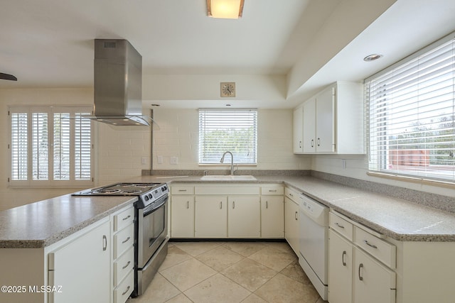 kitchen with white dishwasher, a sink, island range hood, stainless steel range with electric stovetop, and a peninsula