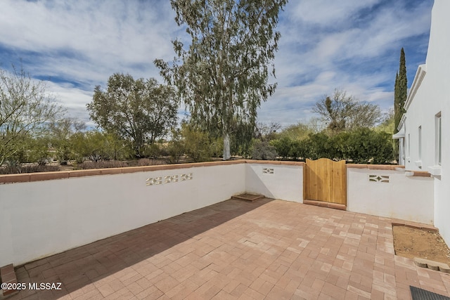 view of patio / terrace featuring a gate