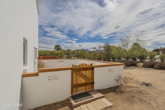 exterior space with fence and a gate