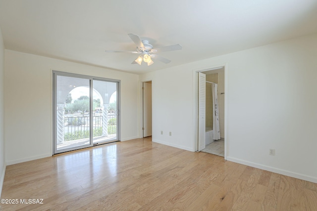 unfurnished room featuring ceiling fan, light wood finished floors, and baseboards