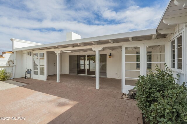 rear view of property featuring a patio area, central AC, and a mountain view