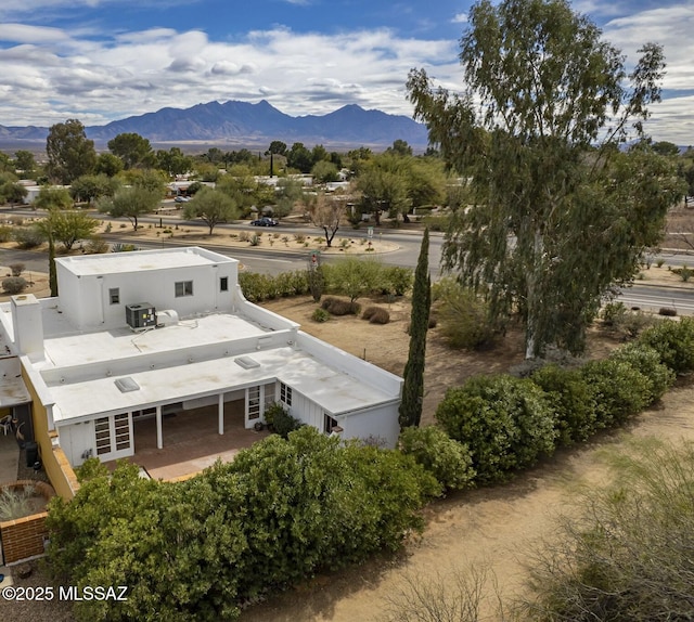 birds eye view of property featuring a mountain view