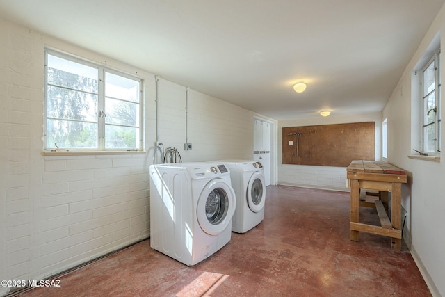 washroom with laundry area and independent washer and dryer