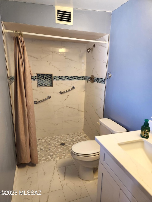 bathroom with a shower with curtain, vanity, and toilet