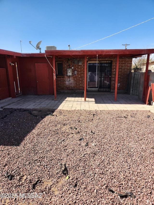 rear view of property with a patio area