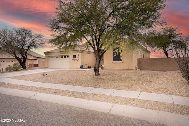 view of front of property with a garage