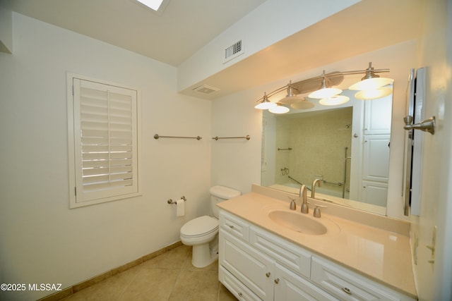 bathroom with tile patterned flooring, vanity, and toilet