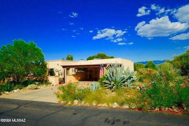 southwest-style home featuring a carport