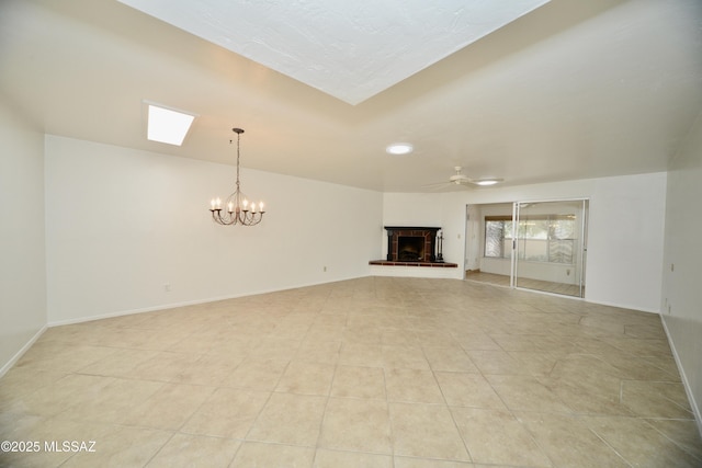 unfurnished living room with light tile patterned flooring and ceiling fan with notable chandelier