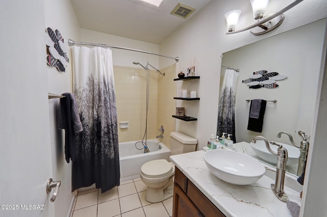 full bathroom featuring vanity, shower / tub combo with curtain, tile patterned floors, and toilet