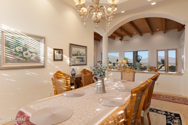 dining area featuring arched walkways, a notable chandelier, a high ceiling, wood ceiling, and beamed ceiling