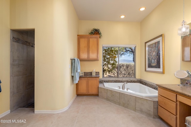 bathroom with baseboards, tile patterned flooring, vanity, a bath, and recessed lighting