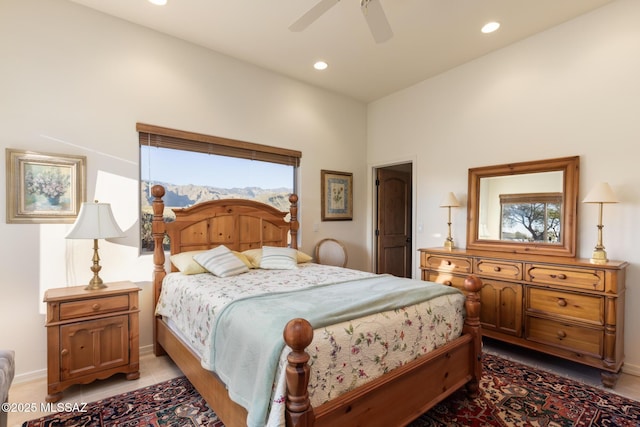 bedroom featuring multiple windows, a mountain view, and recessed lighting