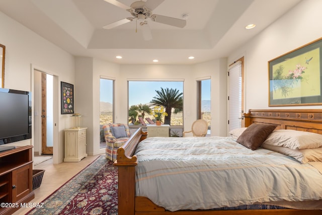 bedroom with recessed lighting, a raised ceiling, and light tile patterned floors