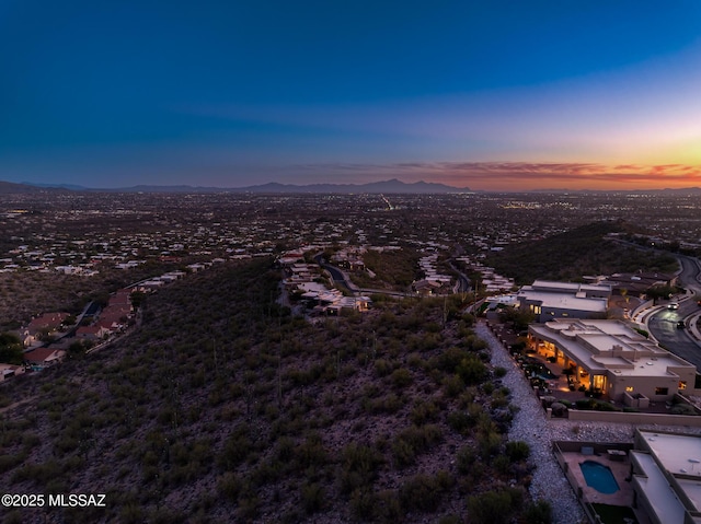 aerial view at dusk with a mountain view