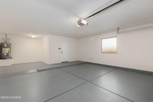 garage featuring water heater, baseboards, and a garage door opener