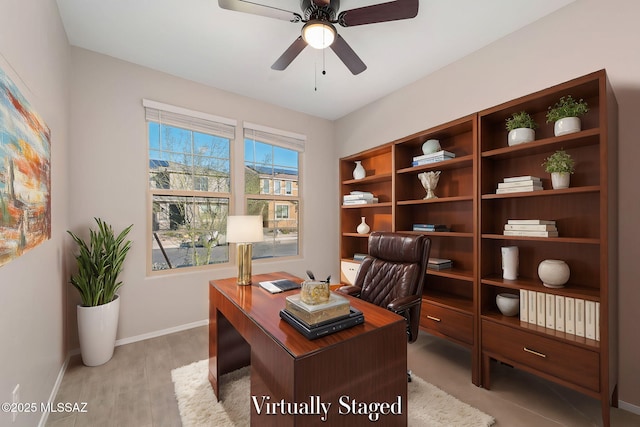 office space with ceiling fan, light wood finished floors, and baseboards