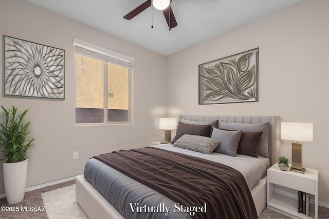 bedroom featuring ceiling fan and light colored carpet