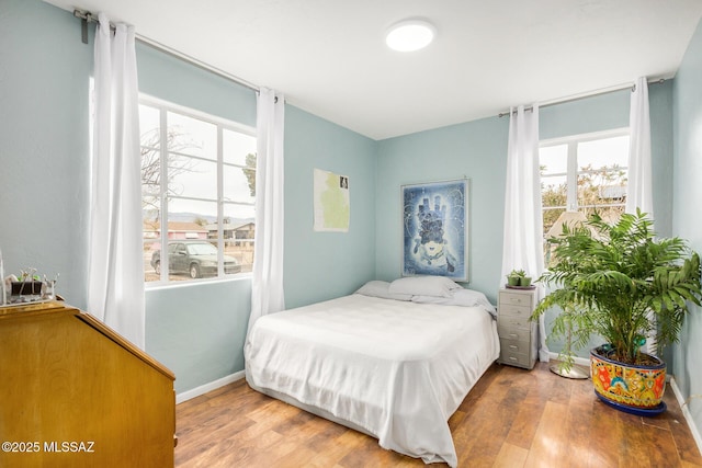 bedroom featuring wood-type flooring