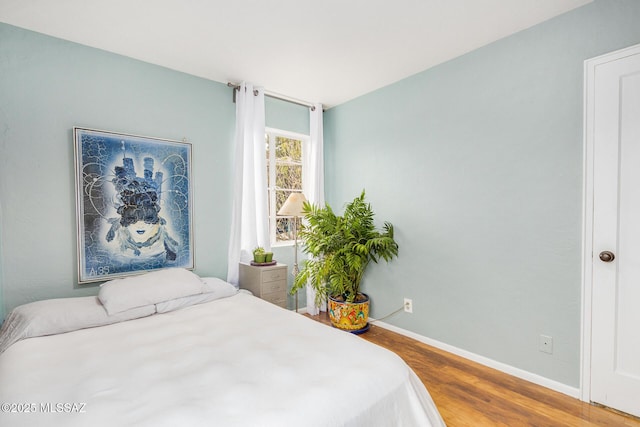 bedroom featuring hardwood / wood-style flooring