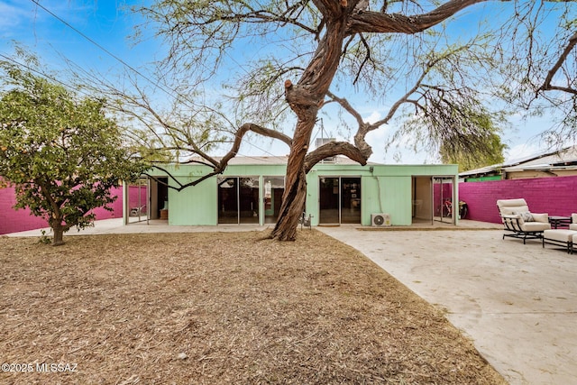 back of house with a patio